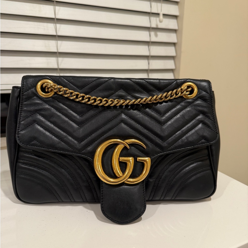 Gucci Black Quilted Bag with Gold Accents